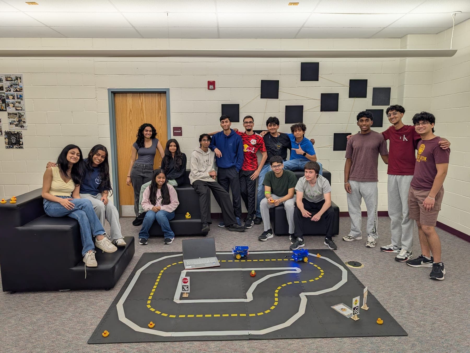 The Computer Science Academy cohort around the full Duckietown track